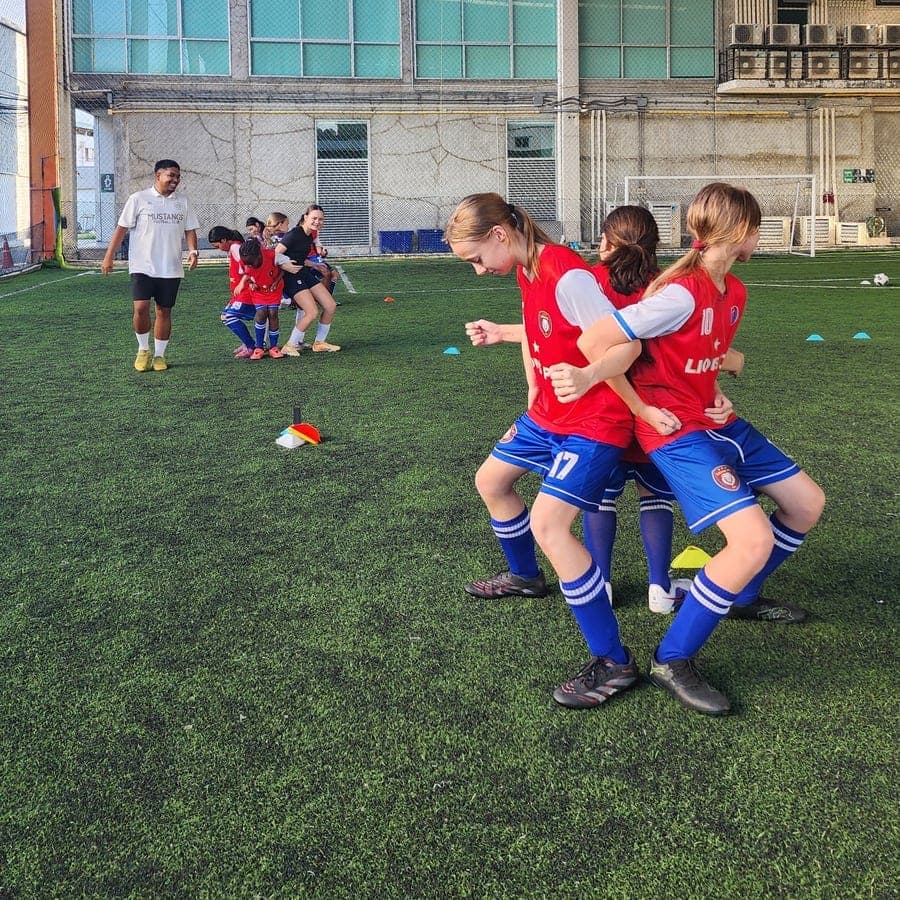 Two players challenging each other for the ball during a drill